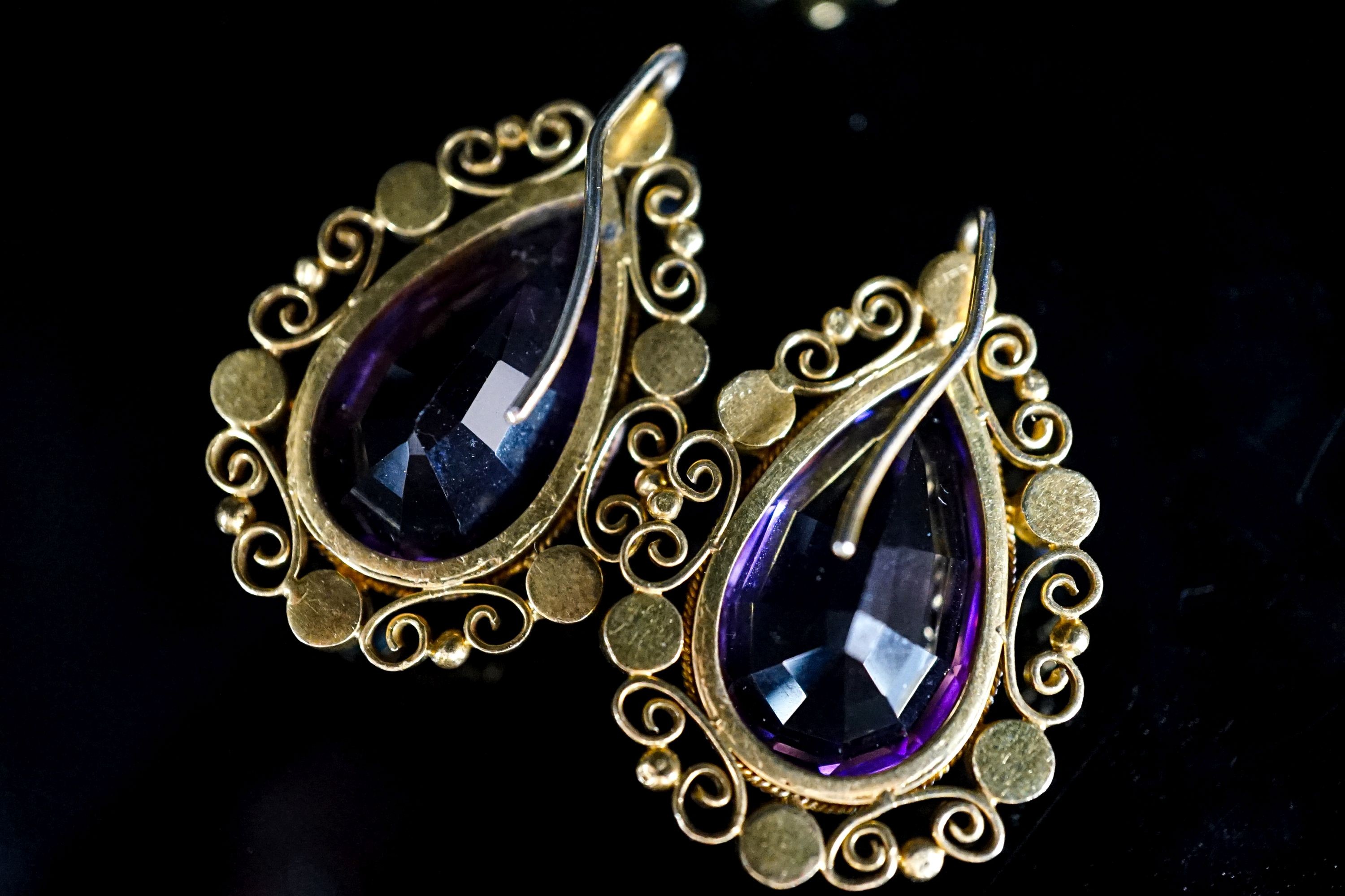 A pair of yellow metal and split pearl mounted pear cut amethyst pendants, 35mm and a pair of similar ear studs, gross weight 23.9 grams.